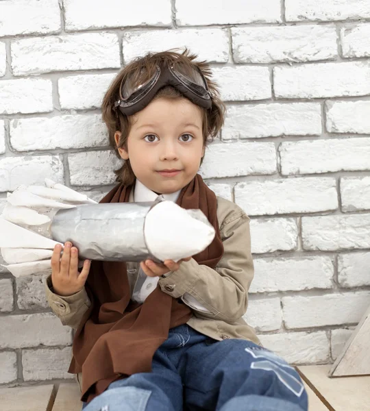 Boy with rocket indoors play — Stock Photo, Image