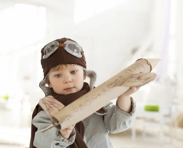 Boy with airplane in hands — Stock Photo, Image