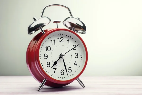 Green alarm clock morning wake-up time — стоковое фото