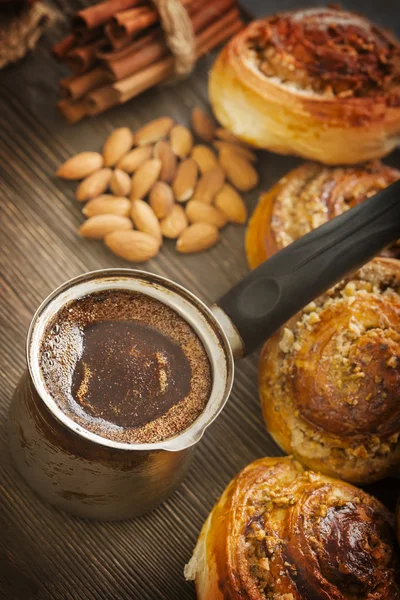 Coffee and cinnamon rolls — Stock Photo, Image