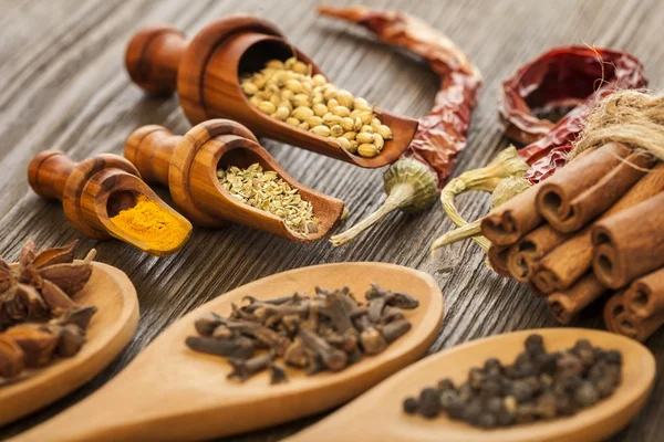 Herbs and Spices over wooden background — Stock Photo, Image