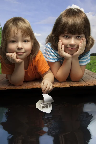 Three boy play in puddle — Stock Photo, Image