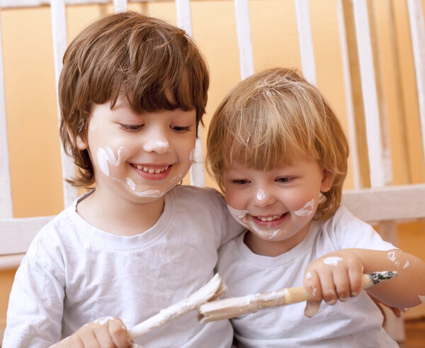 two boys with brush