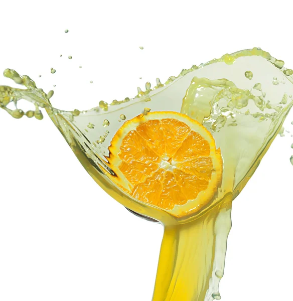 Orange slice in juice stream — Stock Photo, Image