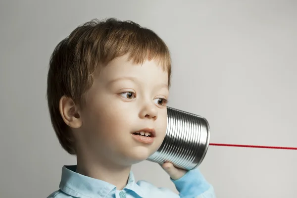 Boy listen tin can telephone — Stock Photo, Image