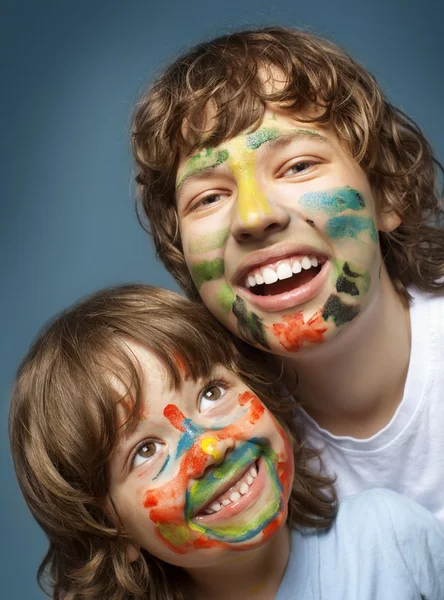 Two cheerful brothers with painted faces — Stock Photo, Image