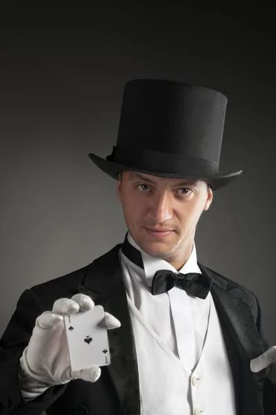 Magician holding playing cards — Stock Photo, Image