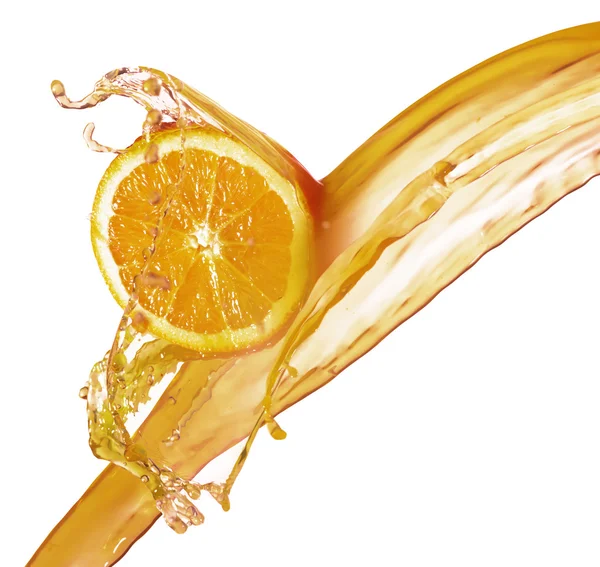 Orange slice in juice stream — Stock Photo, Image