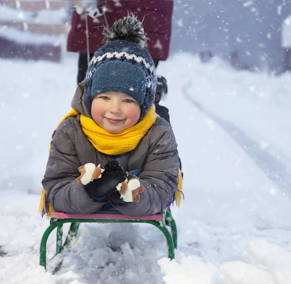 Happy boy with sled — Stock Photo, Image