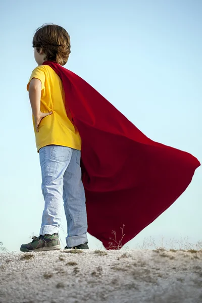 Boy playing superheroes — Stock Photo, Image