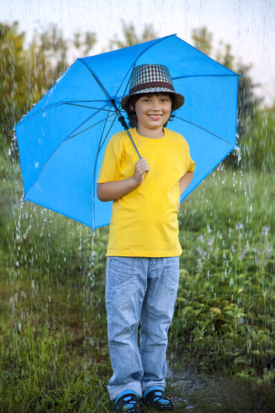 boy with umbrella outdoors