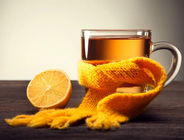 Glass of tea in a scarf — Stock Photo, Image