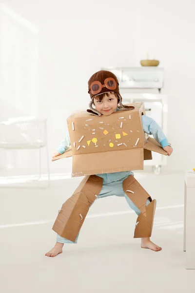 Happy children play in pilot indoors — Stock Photo, Image