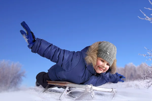 Happy boy on sled — Stock Photo, Image