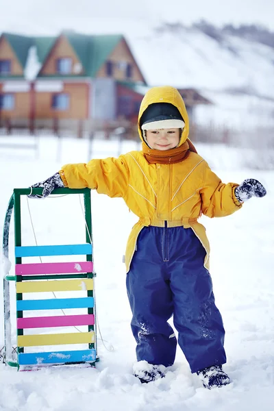 Happy boy with sled — Stock Photo, Image