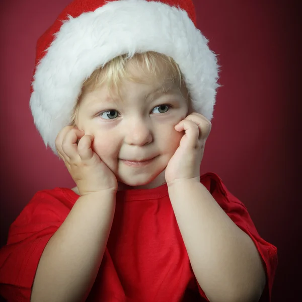 Menino de beleza em chapéu de Natal — Fotografia de Stock