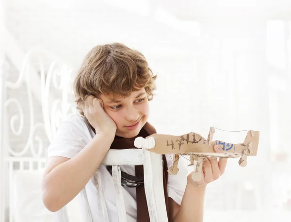 Teenager with model airlplane — Stock Photo, Image