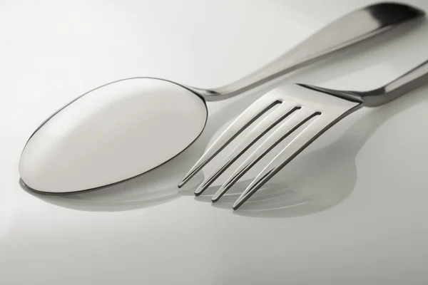 Silverware on white table — Stock Photo, Image