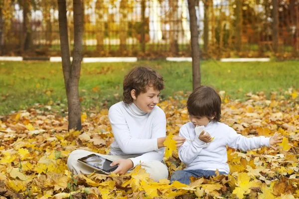Happy boys in autumn park — Stock Photo, Image
