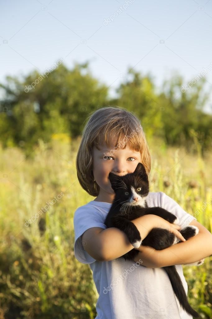 Happy kid with a kitten