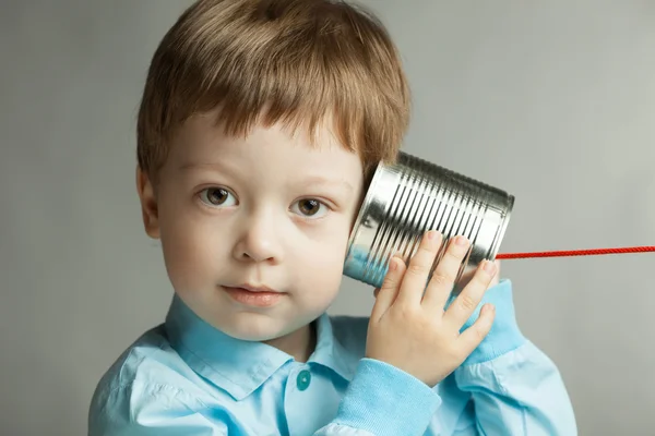 Boy listen tin can telephone — Stock Photo, Image