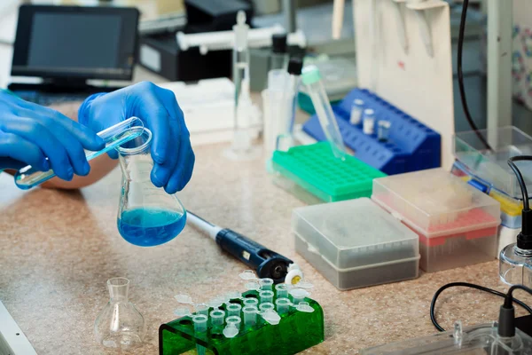 Scientist with test tubes — Stock Photo, Image