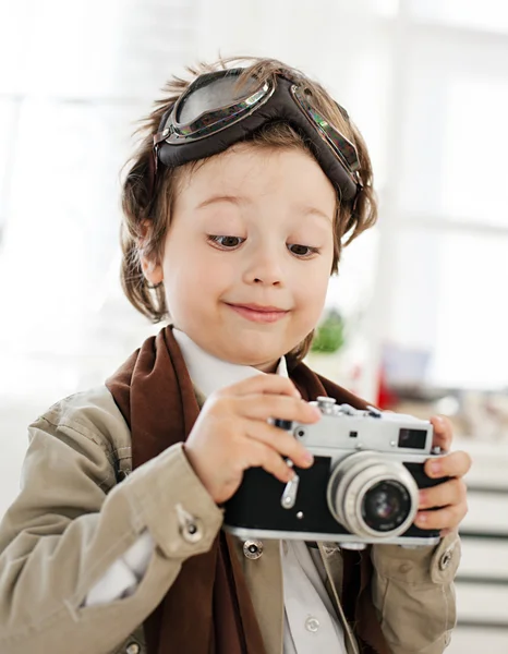 Happy boy with retro camera — Stock Photo, Image