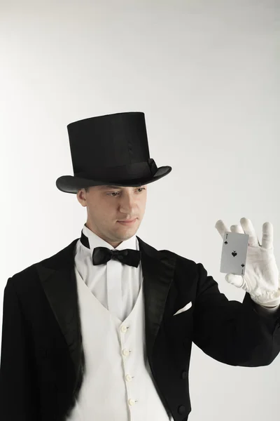 Magician holding playing cards — Stock Photo, Image