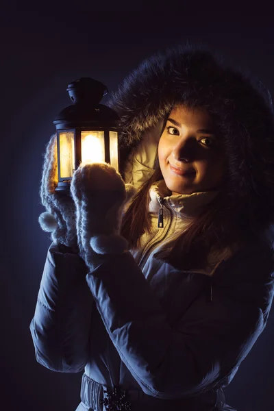 Beautiful girl with lantern seeking in night — Stock Photo, Image