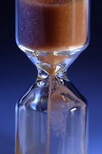 Hourglass on  blue — Stock Photo, Image