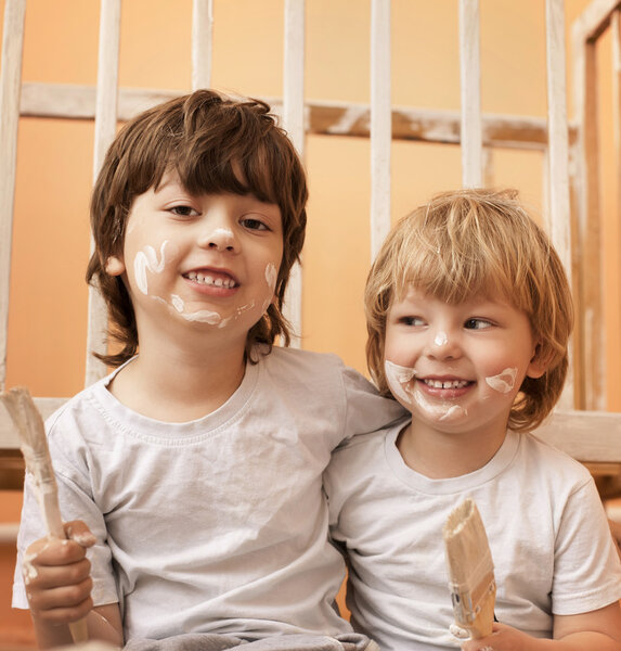 two boys with brush