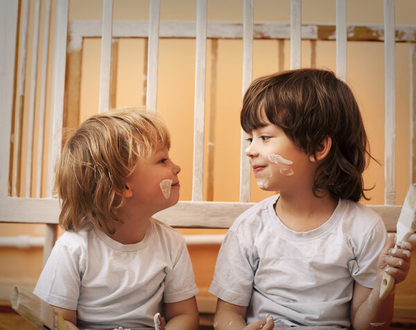 two boys with brush