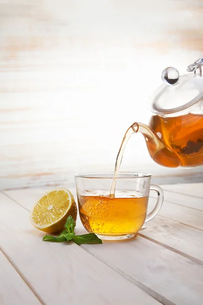 Poured from a teapot cup of tea — Stock Photo, Image