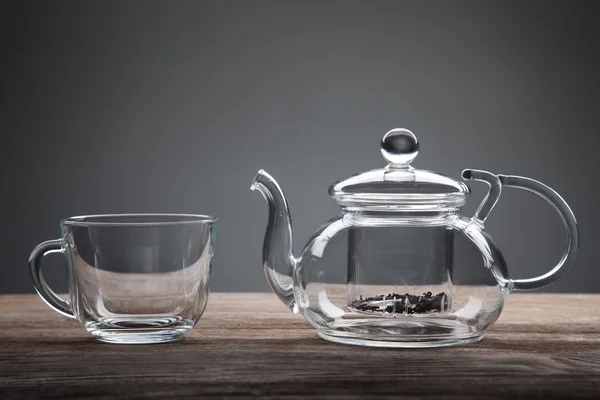 Teapot and cup of tea on wooden table — Stock Photo, Image