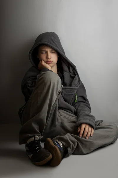 Teenager with problems sitting on floor — Stock Photo, Image