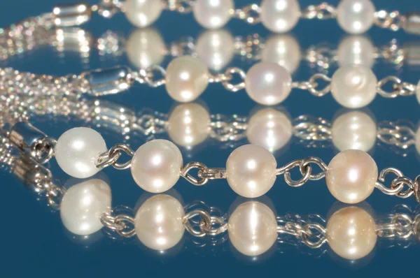 Closeup of pearls on silver necklace — Stock Photo, Image