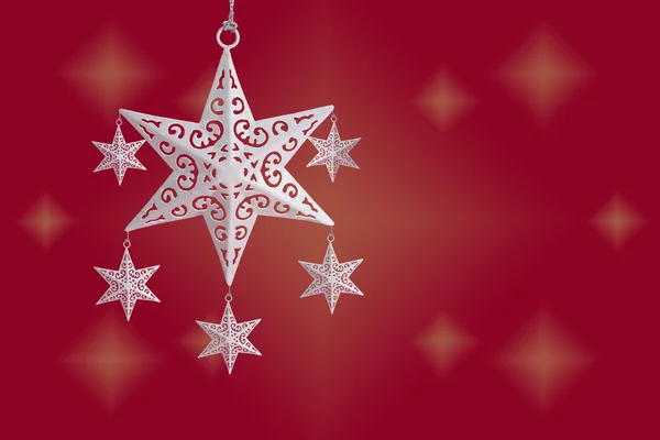 White Christmas star ornament on red starry background, with copy space — Stock Photo, Image