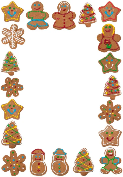 Vertical frame of colorful gingerbread cookies on white, copy space in the middle — Stock Photo, Image