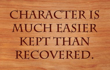 Character is much easier kept than recovered - quote on wooden red oak background clipart