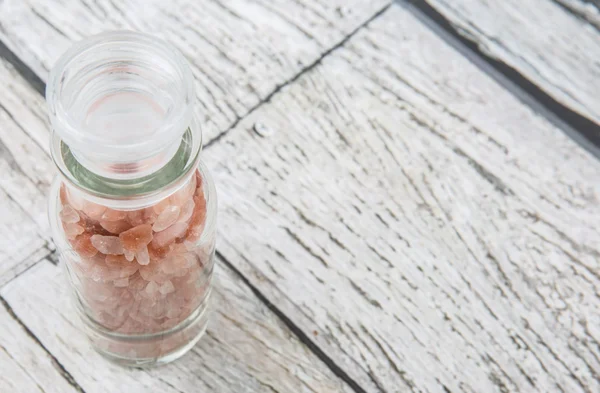 Himalayan Rock Salt Glass Vial Wooden Background — Stock Photo, Image