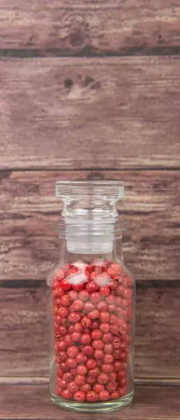 Pink peppercorns Variety In Glass Vial — Stock Photo, Image