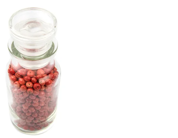 Variedade de pimenta rosa em frasco de vidro — Fotografia de Stock