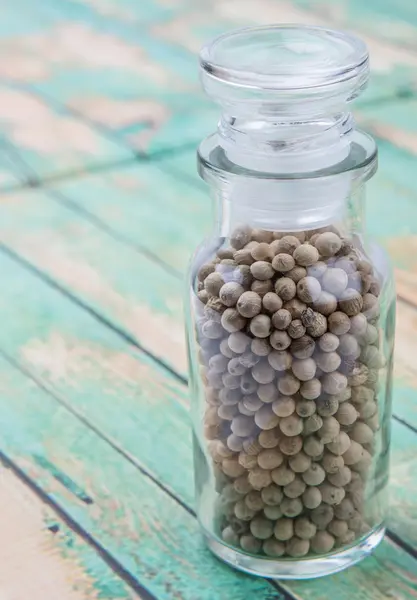 White peppercorns  In Glass Vial — Stock Photo, Image