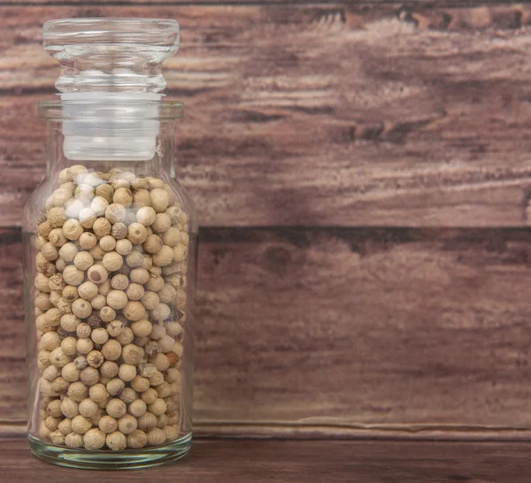 White peppercorns  In Glass Vial — Stock Photo, Image