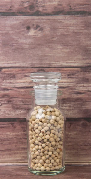 White peppercorns  In Glass Vial — Stock Photo, Image