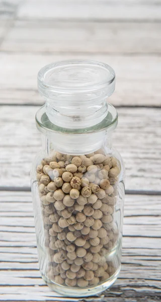 White peppercorns  In Glass Vial — Stock Photo, Image