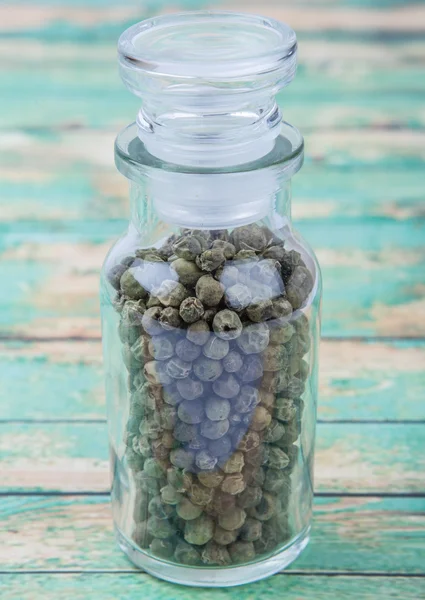 Green peppercorns  In Glass Vial — Stock Photo, Image