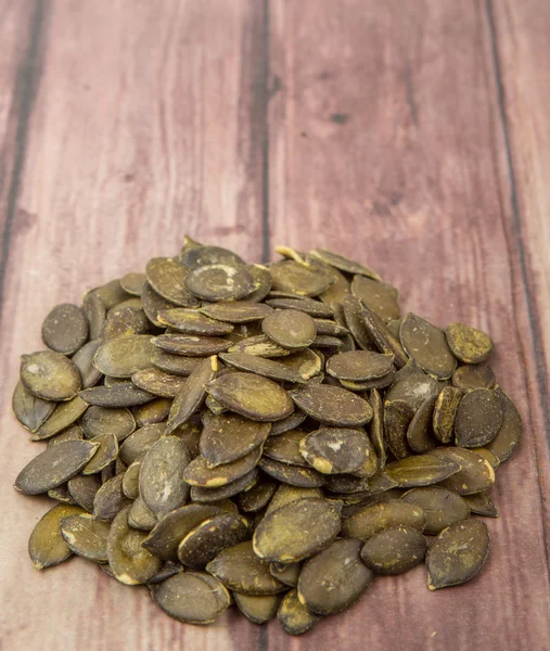 Roasted Pumpkin Seeds Wooden Background — Stock Photo, Image