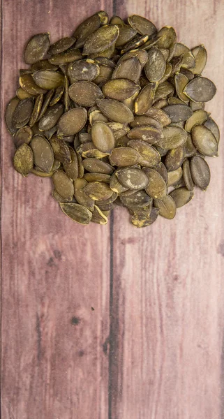 Roasted Pumpkin Seeds Wooden Background — Stock Photo, Image