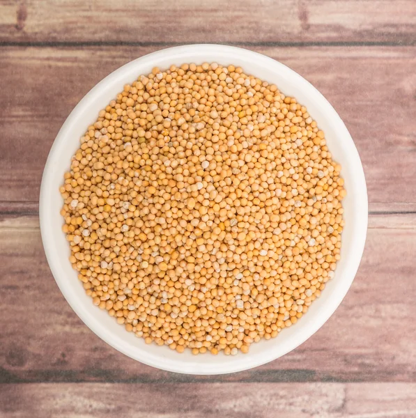 mustard seeds in the white bowl